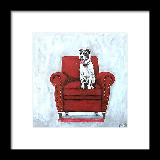 Dog on red chair - Framed Print